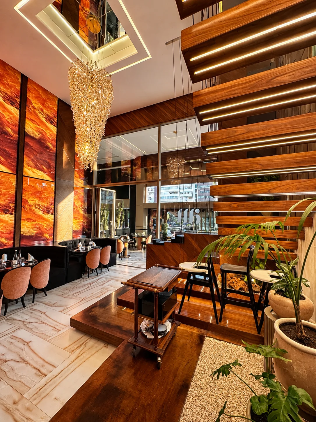 Cantilevered Illuminated Staircase and Tropical Atrium